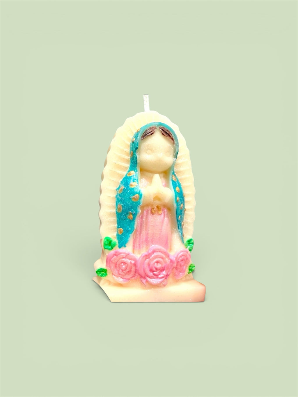 Trinity Candle Co. Our Lady of Guadalupe figural candle with teal mantle, pink gown, and sculpted rose base.